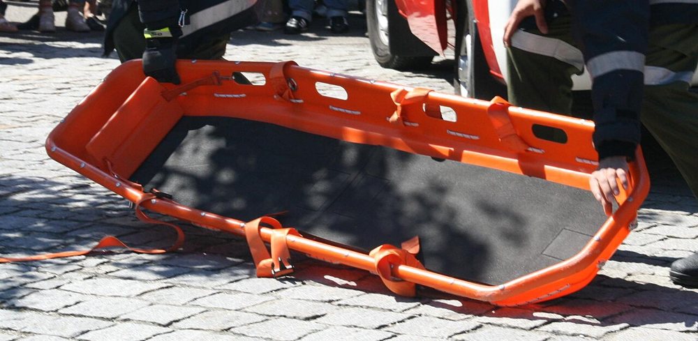 Orange basket stretcher on the ground